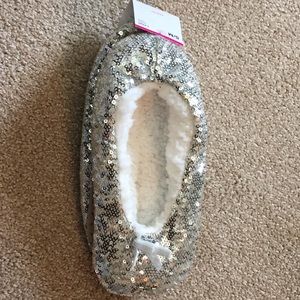 Silver sparkly slippers with grips on the bottom